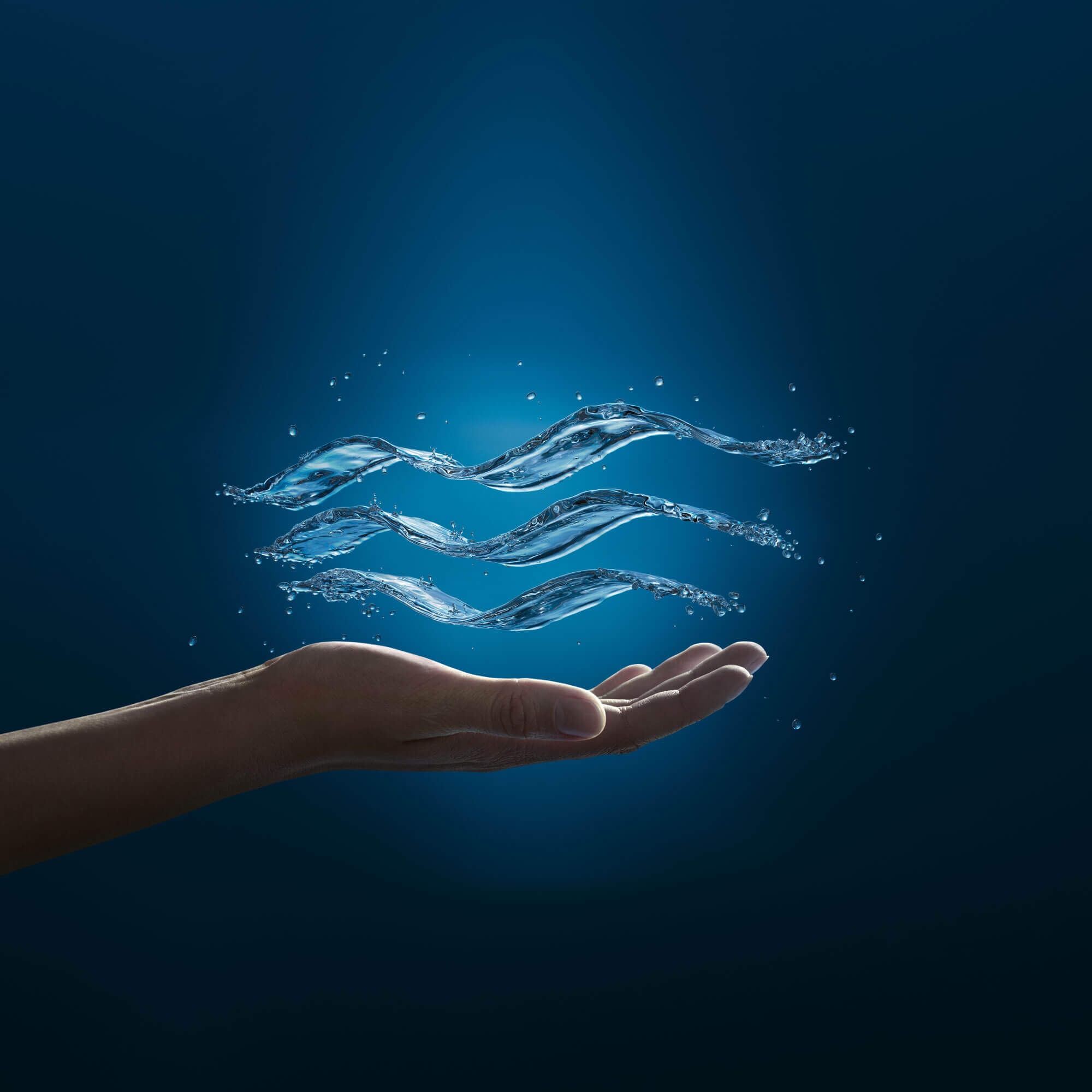 Grohe logo appearing as water floating above hand
